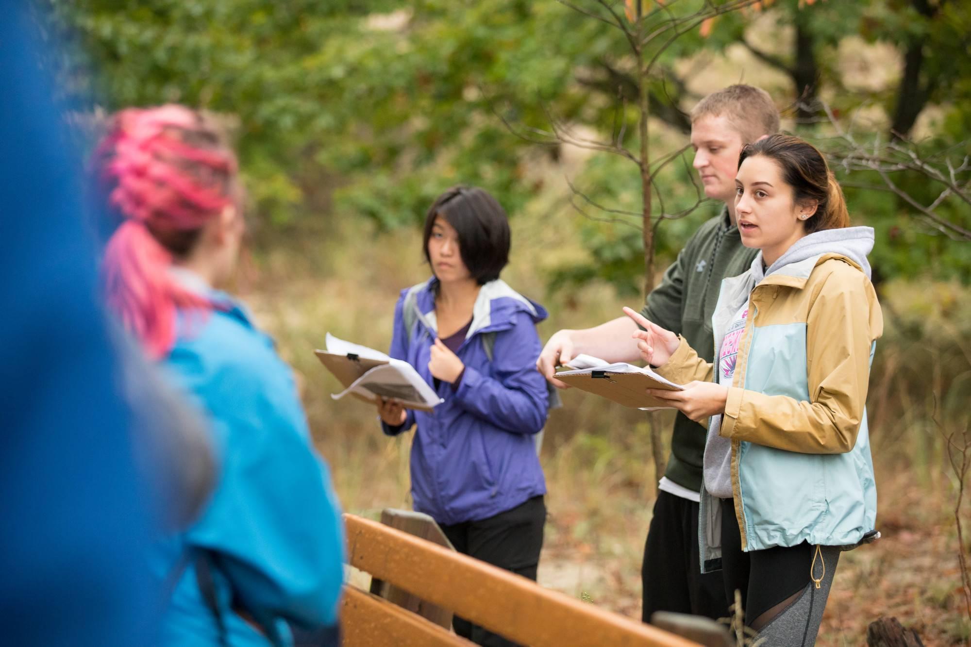 People hiking up rocky trail